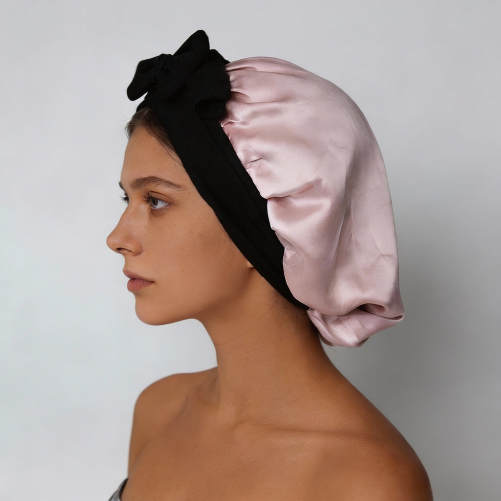 Woman wearing SaltyKurlz mulberry silk bonnet — protects all hair types overnight